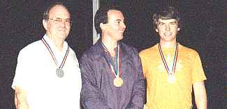 <Gordon, Leslie and Joe Bob receive their medals for table tennis.>